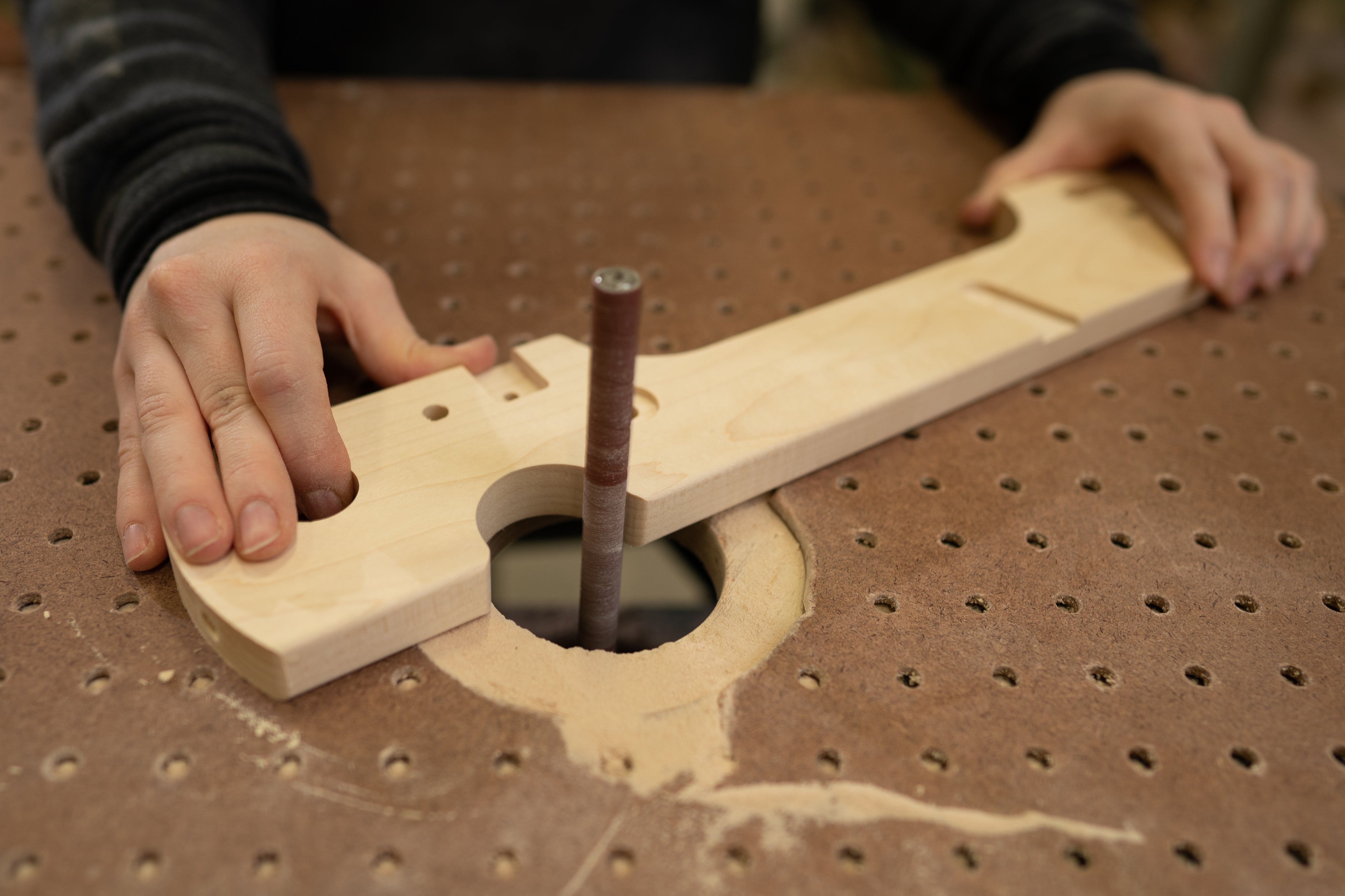 sanding the side of a Flip rigid heddle looom